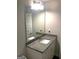 Modern bathroom features granite countertops, white cabinets, and a large mirror at 85 Crabapple Ridge Dr, Oxford, GA 30054
