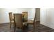 Formal dining room featuring wainscotting detail, modern lighting, and a glass table at 85 Crabapple Ridge Dr, Oxford, GA 30054
