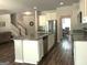 Open-concept kitchen featuring an island with granite countertops and stainless steel appliances at 85 Crabapple Ridge Dr, Oxford, GA 30054