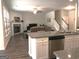 Bright living room featuring a fireplace and an open layout to a modern kitchen with an island at 85 Crabapple Ridge Dr, Oxford, GA 30054