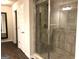 Contemporary walk-in shower featuring glass enclosure, tiled walls, and modern fixtures at 85 Crabapple Ridge Dr, Oxford, GA 30054