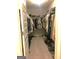 Spacious walk-in closet providing ample storage with organized clothing racks, shelves and storage for shoes at 85 Crabapple Ridge Dr, Oxford, GA 30054