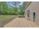 Large deck provides a great vantage point to view the trees and lawn of the yard at 175 Ashley Dr, Fayetteville, GA 30214