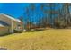 Expansive backyard showing mature trees and lush green space, perfect for outdoor activities and relaxation at 175 Ashley Dr, Fayetteville, GA 30214