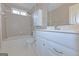 Bathroom features a vanity, toilet, and bathtub with shower head at 175 Ashley Dr, Fayetteville, GA 30214