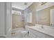 Bright bathroom featuring a tub, shower, vanity, and ample natural light at 175 Ashley Dr, Fayetteville, GA 30214