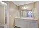 Bathroom with double sinks, shower, and a mirror at 175 Ashley Dr, Fayetteville, GA 30214