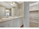 Bathroom features double sinks, cabinets, and a large mirror, with a walk-in closet at 175 Ashley Dr, Fayetteville, GA 30214