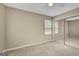 Cozy bedroom featuring a ceiling fan, carpet, window, and mirrored closet at 175 Ashley Dr, Fayetteville, GA 30214
