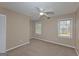 Bedroom with neutral carpet, windows to let in natural light, ceiling fan and closet for storage at 175 Ashley Dr, Fayetteville, GA 30214