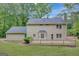 Spacious wooden deck is perfect for outdoor entertaining and overlooks a well-maintained lawn at 175 Ashley Dr, Fayetteville, GA 30214