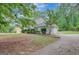 A charming home with a two-car garage and a well-manicured lawn lined with bushes at 175 Ashley Dr, Fayetteville, GA 30214