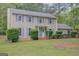 Charming two-story home with blue shutters, a well-manicured lawn, and a welcoming front entrance at 175 Ashley Dr, Fayetteville, GA 30214