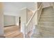 Bright foyer featuring beautiful flooring, an adjacent room with stone fireplace, and neutral walls at 175 Ashley Dr, Fayetteville, GA 30214