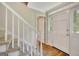Bright entryway showcasing new flooring, a stairway, and a front door with sidelights at 175 Ashley Dr, Fayetteville, GA 30214