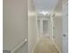 Hallway leading to various rooms, with carpet flooring and neutral paint at 175 Ashley Dr, Fayetteville, GA 30214