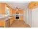 Kitchen featuring stainless appliances, abundant wood cabinets, eat-in dining space and vinyl floors at 175 Ashley Dr, Fayetteville, GA 30214