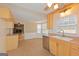 Spacious kitchen with stainless appliances and plenty of cabinet space opens to a fireplace den at 175 Ashley Dr, Fayetteville, GA 30214