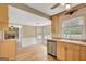 Kitchen view into an open-concept room with a stone fireplace at 175 Ashley Dr, Fayetteville, GA 30214