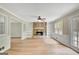 Living room showcasing the stone fireplace and a view of the backyard at 175 Ashley Dr, Fayetteville, GA 30214