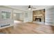 Living room showcasing a stone fireplace and views of adjacent rooms at 175 Ashley Dr, Fayetteville, GA 30214