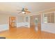 Open-concept living room featuring hardwood floors with a view into the kitchen at 175 Ashley Dr, Fayetteville, GA 30214