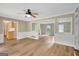 Living room with light wood floors, wainscoting, and built-in shelves at 175 Ashley Dr, Fayetteville, GA 30214