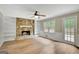 Bright living room with stone fireplace, built-in shelves and backyard views at 175 Ashley Dr, Fayetteville, GA 30214