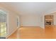 Bright living room with hardwood flooring and a stone fireplace at 175 Ashley Dr, Fayetteville, GA 30214