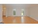 Bright living room with hardwood floors and large double windows at 175 Ashley Dr, Fayetteville, GA 30214