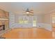 Living room featuring a stone fireplace, built-in shelving, and hardwood floors at 175 Ashley Dr, Fayetteville, GA 30214