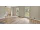 Bright living room features two large windows and light wood floors at 175 Ashley Dr, Fayetteville, GA 30214