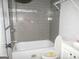 Bathroom with gray tile shower and white toilet and sink at 1876 Sw Sandtown Sw Rd, Atlanta, GA 30311