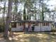 Charming single-story home with red shutters and landscaped front yard at 1876 Sw Sandtown Sw Rd, Atlanta, GA 30311