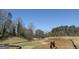 Picturesque golf course under construction, featuring lush greenery, mature trees, and earthmoving equipment at 1876 Sw Sandtown Sw Rd, Atlanta, GA 30311