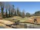 Scenic golf course under development, showcasing lush greenery, mature trees, and construction equipment at 1876 Sw Sandtown Sw Rd, Atlanta, GA 30311