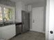 Functional kitchen with white cabinets, stainless steel appliances and tile flooring at 1876 Sw Sandtown Sw Rd, Atlanta, GA 30311