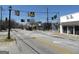 Street view of intersection with storefronts and traffic signals on a sunny day at 1876 Sw Sandtown Sw Rd, Atlanta, GA 30311