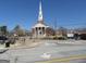 Street view of church with tall steeple, surrounded by greenery and sidewalk at 1876 Sw Sandtown Sw Rd, Atlanta, GA 30311