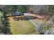 Expansive aerial view of home with long driveway and ample green space at 850 Coan Dr, Locust Grove, GA 30248