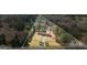 Aerial view of property highlighting the home, surrounding trees, and landscaping at 850 Coan Dr, Locust Grove, GA 30248