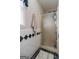 Bathroom featuring tiled walls and a shower with a frosted glass door at 850 Coan Dr, Locust Grove, GA 30248