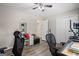 Neutral-toned bedroom with hardwood floor, ceiling fan, closet, and lots of natural light at 850 Coan Dr, Locust Grove, GA 30248
