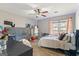 Bedroom with a ceiling fan, a window, and wood-look floors at 850 Coan Dr, Locust Grove, GA 30248
