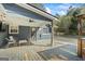 Relaxing covered deck featuring a ceiling fan, outdoor seating, and entertainment area at 850 Coan Dr, Locust Grove, GA 30248