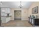 Dining area featuring hardwood floors, chandelier lighting and view of Kitchen and entry hall at 850 Coan Dr, Locust Grove, GA 30248