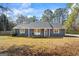 Charming blue single-story home with wooden shutters and a welcoming front porch swing at 850 Coan Dr, Locust Grove, GA 30248