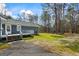 Backyard view of the home with a deck and shed at 850 Coan Dr, Locust Grove, GA 30248