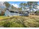 Home exterior showcasing a wooden deck, gray siding, and outdoor space at 850 Coan Dr, Locust Grove, GA 30248
