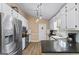 Modern kitchen with stainless steel appliances, granite countertops, and white cabinets at 850 Coan Dr, Locust Grove, GA 30248